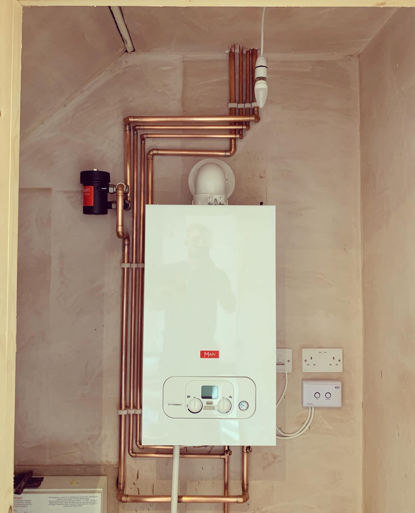 High-efficiency boiler with copper pipework setup.