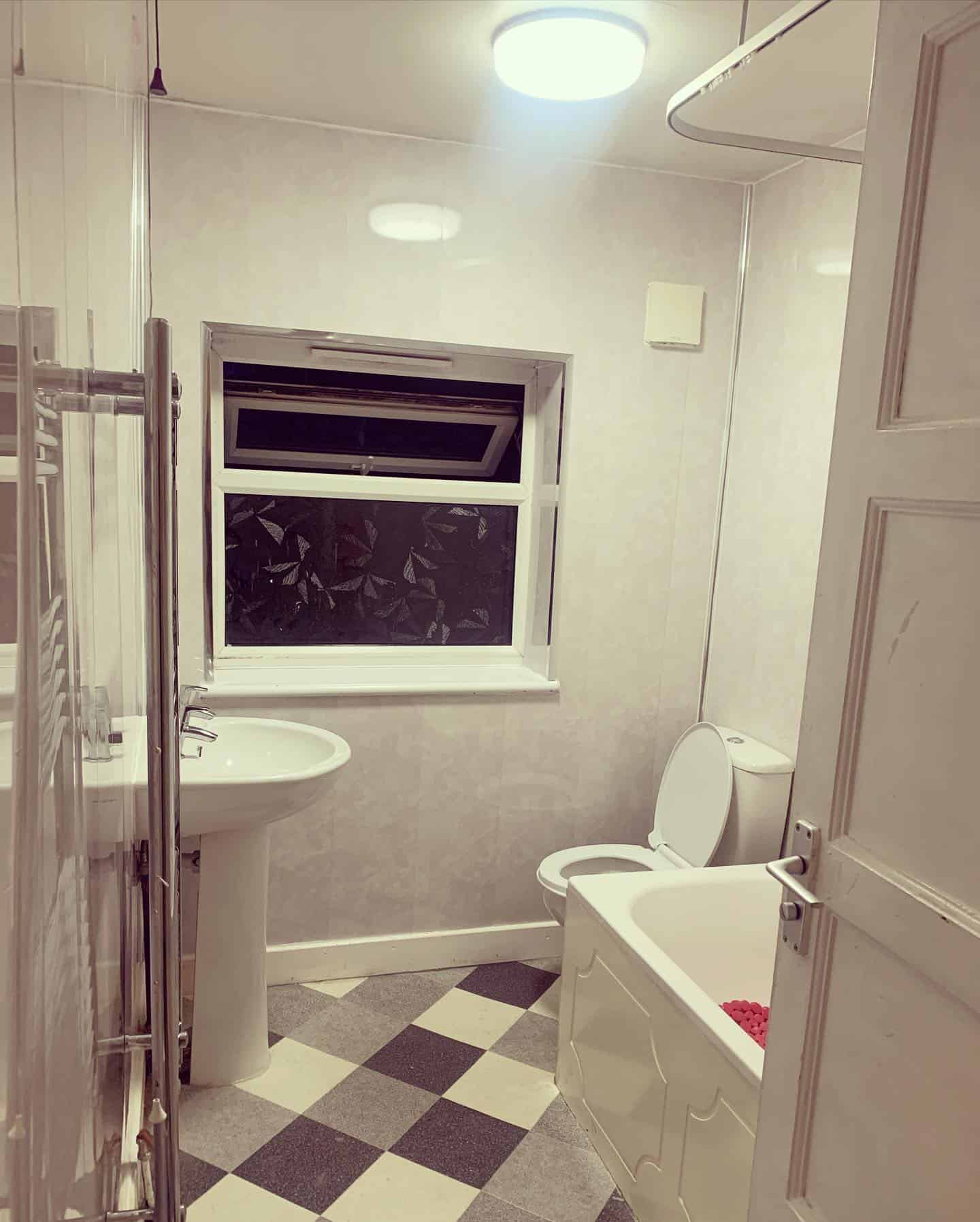 Bathroom with modern plumbing fixtures and reliable heating system.