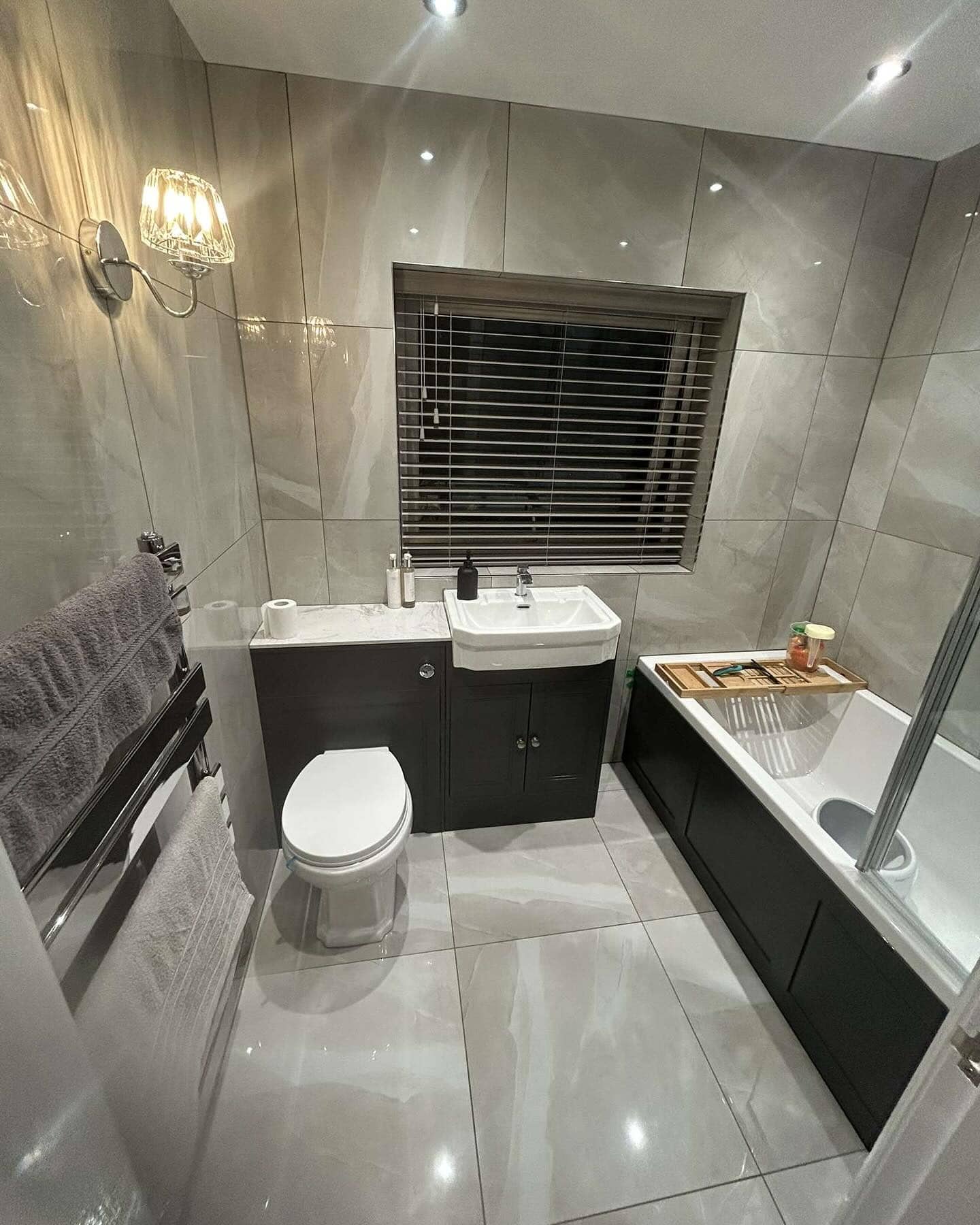 Bathroom plumbing and heating installation with modern fixtures and efficient water heating system.